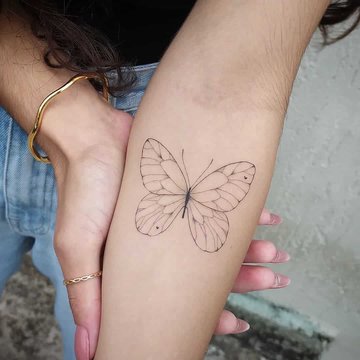 butterfly-tattoo-woman-simple-cute-outline-linework-inner-forearm-tattoo