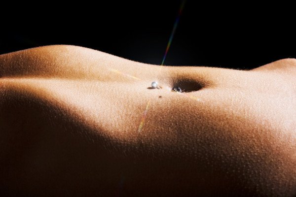 depositphotos_6096865-stock-photo-woman-pierced-belly.jpg